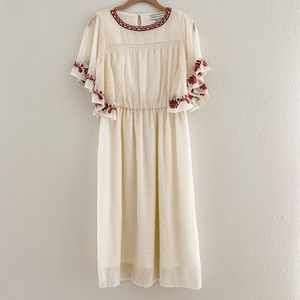 Cream dress with burnt red accents from Piper and Scoot